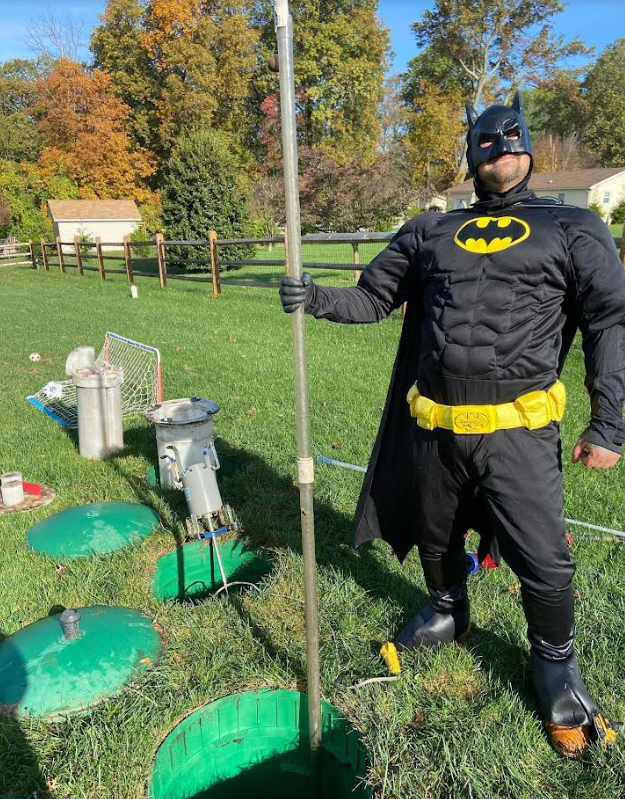 Septic employee dressed as Batman
